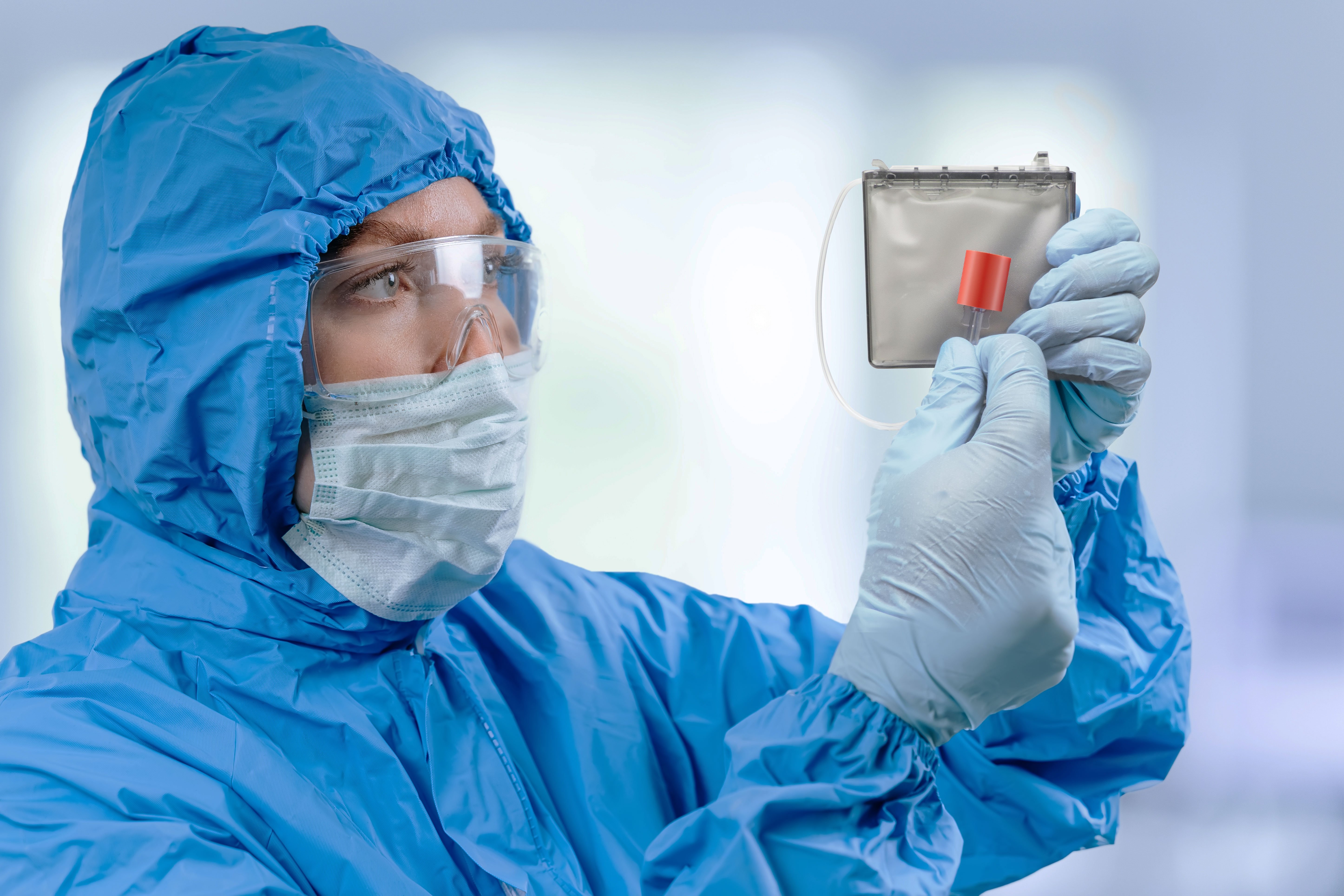 medic-in-hazmat-protective-suit-holds-a-cadd-cassette-2025-04-08